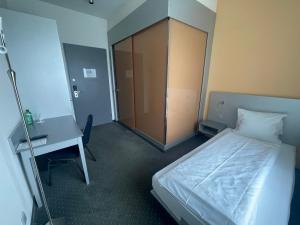 Postel nebo postele na pokoji v ubytování Hotel & Gasthaus Die Perle