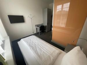 Postel nebo postele na pokoji v ubytování Hotel & Gasthaus Die Perle
