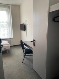 TV a/nebo společenská místnost v ubytování Hotel & Gasthaus Die Perle