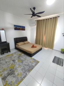 a bedroom with a bed and a ceiling fan at Homestay Banting Selangor in Banting