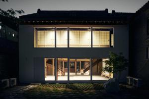 a house with large windows on the side of it at hotel jin #JIN in Tsushima +22 photos