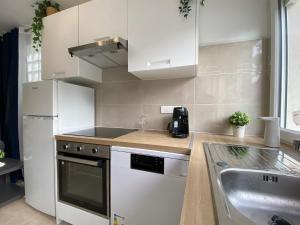 Dapur atau dapur kecil di Résidences des pruniers proche Paris-Orly