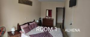Letto o letti in una camera di guesthouse emaly