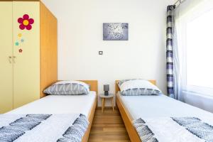 Postel nebo postele na pokoji v ubytování Apartment Vidak