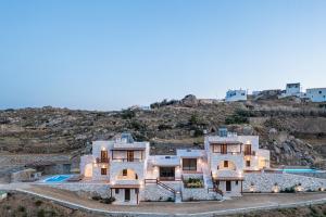 an aerial view of a house on a hill at Marble Arch Apartments in Naxos Chora