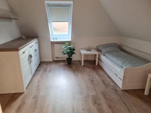 Ein Bett oder Betten in einem Zimmer der Unterkunft Treeneperle
