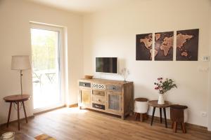 TV a/nebo společenská místnost v ubytování Nora Apartments + 29 fotografií