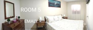 Letto o letti in una camera di guesthouse emaly