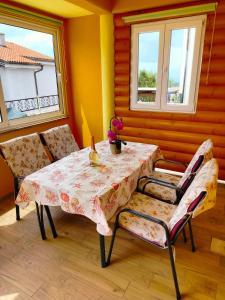 a dining room with a table and two chairs at Apartment Gebic Ivan in Crikvenica