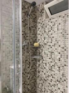 a bathroom with a shower with a glass door at Olives Villa in Sinoikismós Kámbos +33 photos