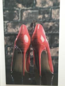 a pair of red high heels with hearts on them at Apartamento Pepi Adults Only in Santa Pola