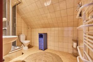a bathroom with a toilet and a sink at AVILA in Niechorze +26 photos