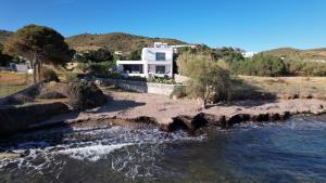 a house on a hill next to a river at Villa Agios Isidoros in Gourna