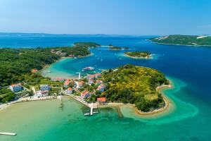 an aerial view of a small island in the ocean at Apartments Darko by the sea in Supetarska Draga