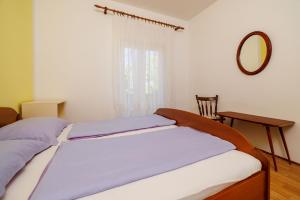 Postel nebo postele na pokoji v ubytování Apartments Darko