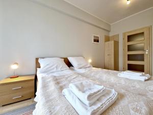 Łóżko lub łóżka w pokoju w obiekcie Casa Marina Spa by Baltic Home