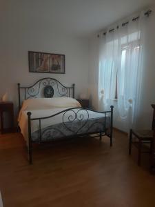 En eller flere senge i et værelse på Alloggio Petrigh