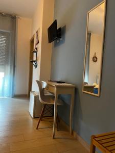 TV a/nebo společenská místnost v ubytování Appartamento AmareTrani