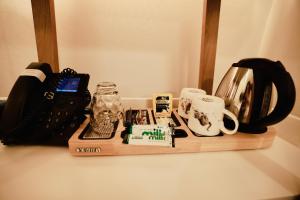 a wooden shelf with items on top of a table at Doune Guest House in St. Andrews