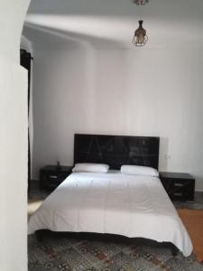 Ένα ή περισσότερα κρεβάτια σε δωμάτιο στο Magnifique petite villa a 1 min de la plage