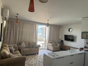 Μια τηλεόραση ή/και κέντρο ψυχαγωγίας στο Luxurious penthouse Fouka Bay Ras El- Hekma