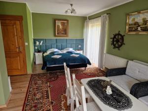 Postel nebo postele na pokoji v ubytování Rezydencja Nad Potoczkiem