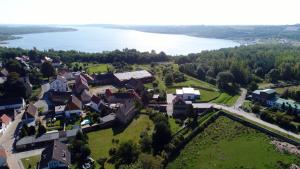 an aerial view of a town with a lake at Ferienwohnungen Auszeit am Geiseltalsee in Stöbnitz