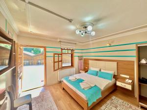 A bed or beds in a room at Konak Grand Apart