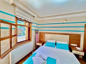 Postel nebo postele na pokoji v ubytování Konak Grand Apart