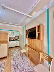 A television and/or entertainment centre at Konak Grand Apart