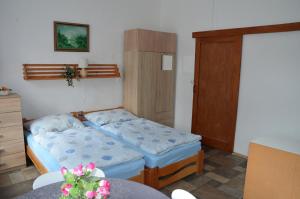 Postel nebo postele na pokoji v ubytování Ubytování u zámku