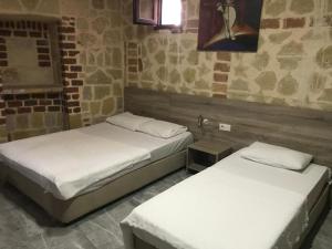 En eller flere senge i et værelse på SunAnatolia Otel
