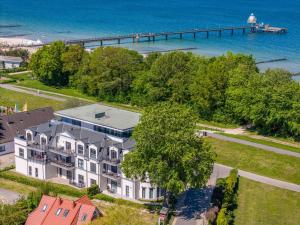 an aerial view of a large house with a pier at Logierhaus Friedrich WE 11 - "Strandmuschel" in Zingst