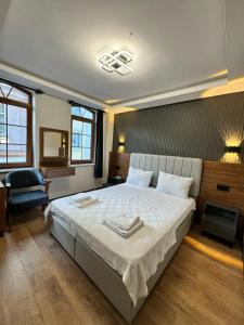 a bedroom with a large bed with two plates on it at SkyLife OldCity Hotel in Istanbul