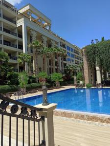 a large apartment building with a large swimming pool at Argisht complex apart 208 in Golden Sands