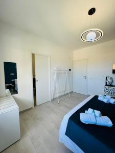 Postel nebo postele na pokoji v ubytování Sirio rooms and apartments