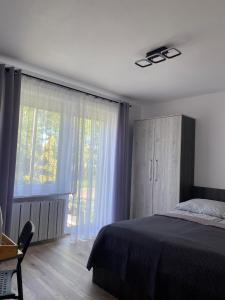 Postel nebo postele na pokoji v ubytování DAWIDEK