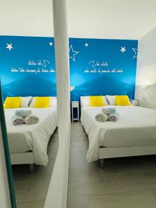 Postel nebo postele na pokoji v ubytování Sirio rooms and apartments