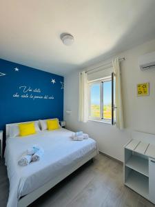 Postel nebo postele na pokoji v ubytování Sirio rooms and apartments