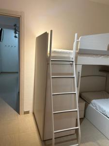 a room with two bunk beds and a ladder at Vacanze toscane Relax privacy in San Baronto