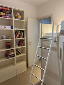 a room with a bunk bed and a book shelf at Vacanze toscane Relax privacy in San Baronto