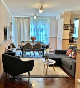 a living room with a couch and a table at Very Cozy Apartment at ARED Arad in Arad