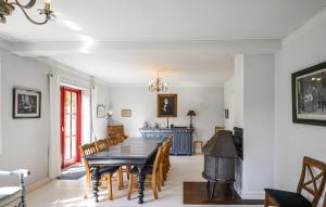 a dining room with a table and chairs at Cozy Home In Anholt With Wifi in Anholt