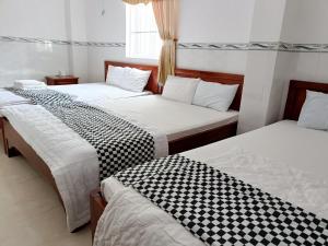 Postel nebo postele na pokoji v ubytování Anh Tan Hotel