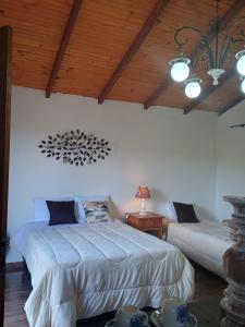 Ένα ή περισσότερα κρεβάτια σε δωμάτιο στο Chalé Torneados