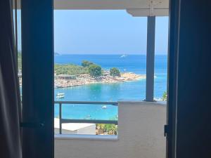 a view of the ocean from a balcony at Dine Hotel in Ksamil
