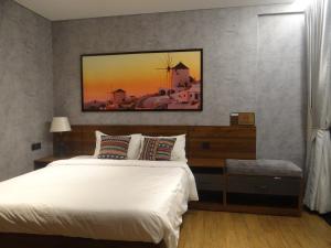 מיטה או מיטות בחדר ב-Kira Kira 's Apartment, Apec Mandala Phu Yen Condotel
