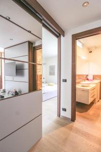 a kitchen with a large glass door leading to a bathroom at Al Funtanin in San Siro