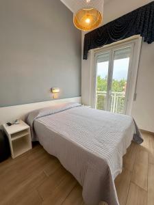 Postel nebo postele na pokoji v ubytování Hotel Amelia + 25 fotografií