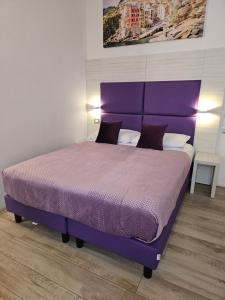 Postel nebo postele na pokoji v ubytování Affittacamere 5 Terre Dolci Sogni